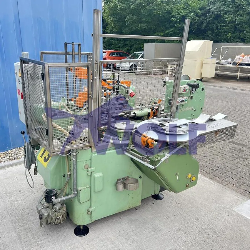 Stannioliermaschine RASCH - Type RU-DC mit Banderolenstation und Vakuumpumpe.