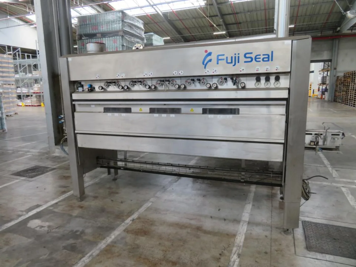 Fuji Seal Europe BV Fuji Seal Heat Shrink Tunnel - Flasche Sleever Line - 4