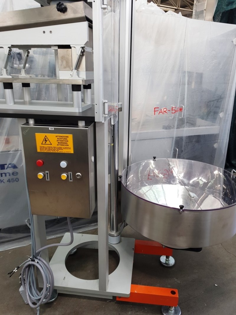 ELEVATORE ALIMENTATORE PER CAPSULE COMPRESSE – CAM