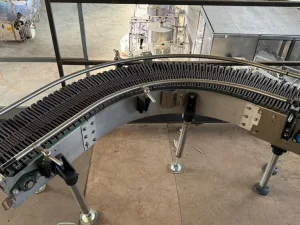 CURVED ROLLER CONVEYOR PREDISPOSED FOR MOTORIZATION, WITH MOTORIZED PLASTIC CHAIN AND TRANSPORT ROLLERS, SECOND-HAND EQUIPMENT