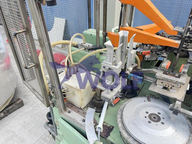 Stannioliermaschine RASCH - Type RU-DC mit Banderolenstation und Vakuumpumpe.