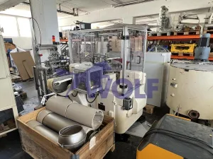 Stannioliermaschine RASCH - Type RU mit Doppeldrehstation und Auslaufband.