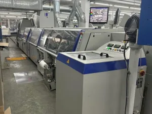 Kolbus KM 600 perfect binding line with inline front cutter