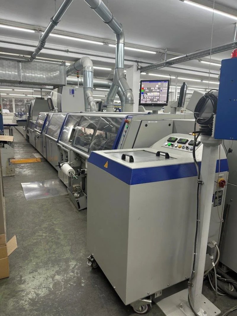 Kolbus KM 600 perfect binding line with inline front cutter