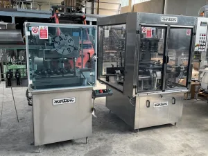 CAPSULE DISTRIBUTOR NORTAN MODEL MULTICAP 120 AND ROLLING MACHINE NORTAN FOR CAPSULES, MODEL AURORA 120, SECOND-HAND MACHINES