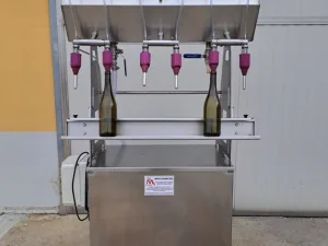 IN-LINE FILLER 6 NOZZLES FIRM MF IN STAINLESS STEEL ON WHEELS, SECOND HAND MACHINE