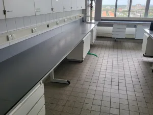 2086 - Used L-shaped S+B laboratory wall table (710/547 cm)