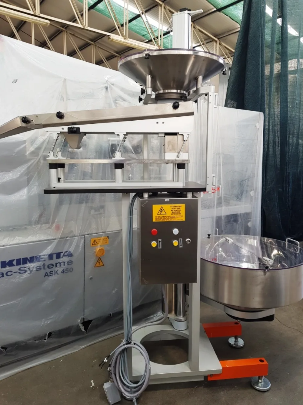 ELEVATORE ALIMENTATORE PER CAPSULE COMPRESSE – CAM