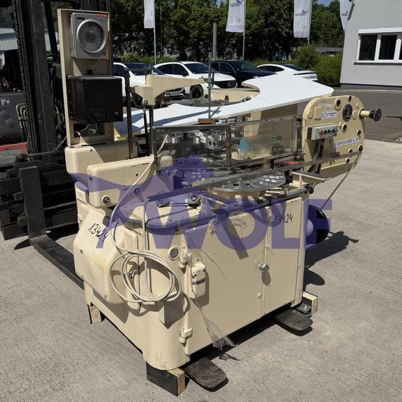Stannioliermaschine RASCH - Type RU-E, mit Abrollstation.