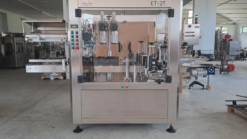 OMB THREE-STATION ADHESIVE LABELLING MACHINE WITH CAPSULE DISTRIBUTOR, SECOND-HAND MACHINE