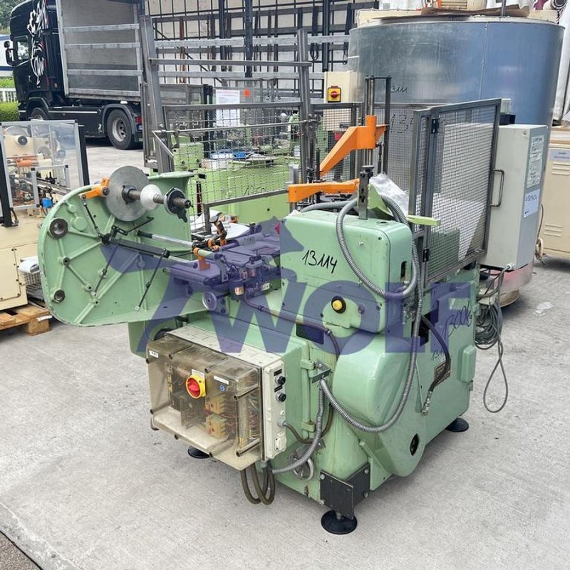 Stannioliermaschine RASCH - Type RU-DC mit Banderolenstation und Vakuumpumpe.