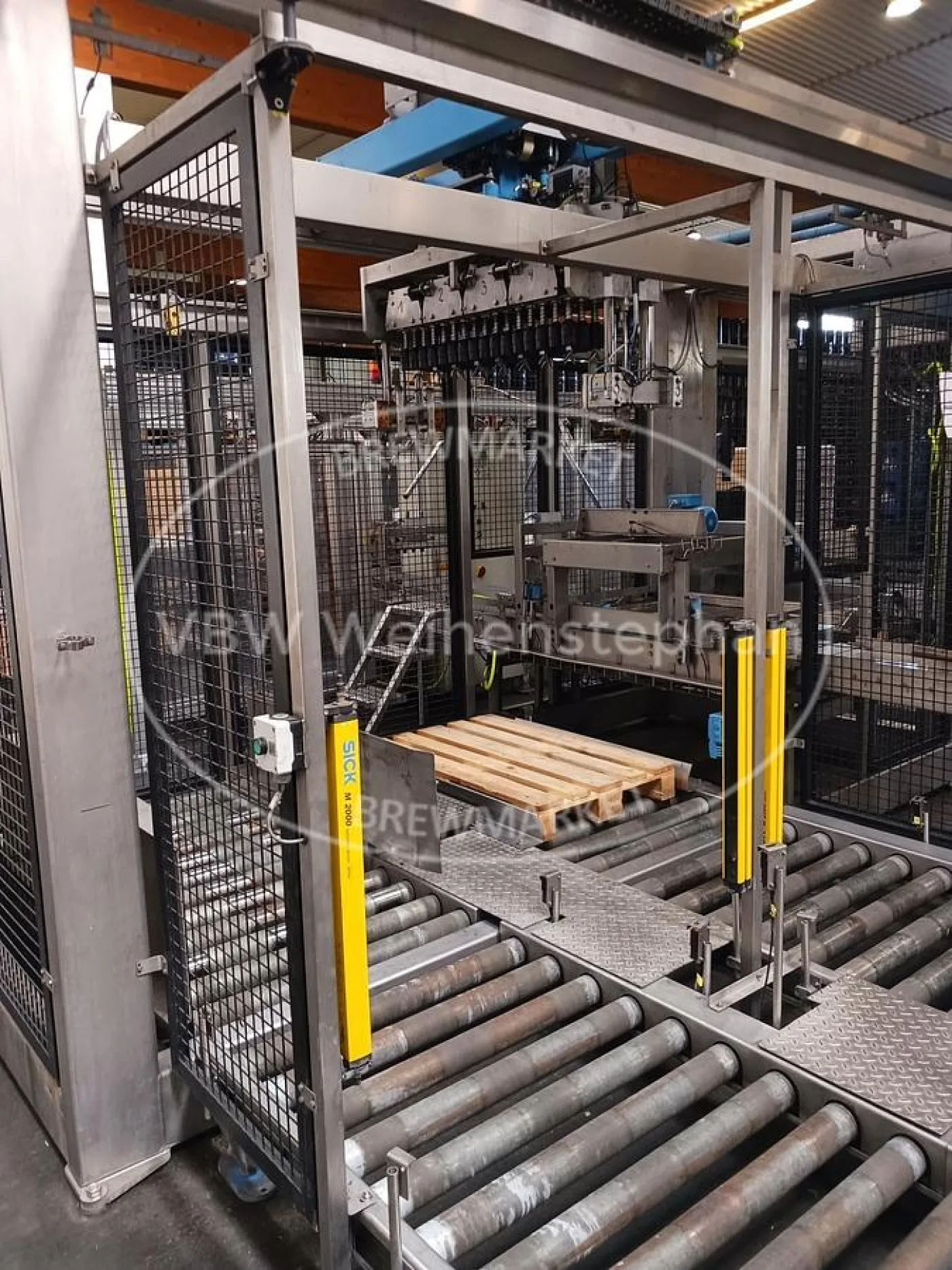 Repalletising system with crating machine - 2