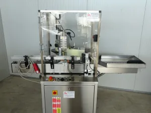 ONE STATION ADHESIVE LABELLING MACHINE FOR LABEL AND BACK ON THE SAME ROLL NEW MACHINE