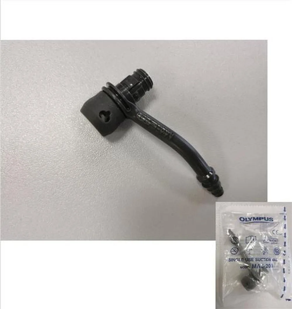 Single use biopsy suction valve