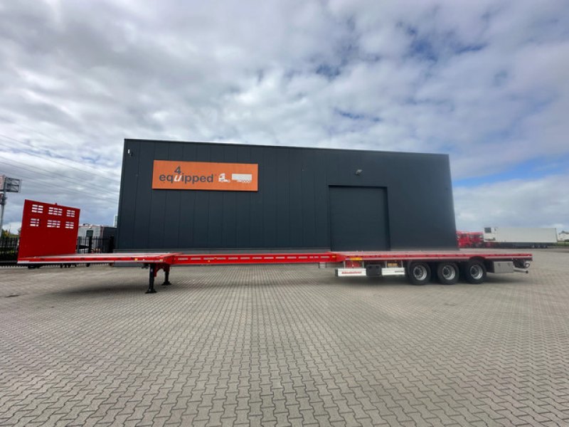 new and unused Heavy-Duty flatbed / 690cm extendable / steering axle / lift axle / twistlocks / timberstakes / NL-trailer / APK: 04-2027