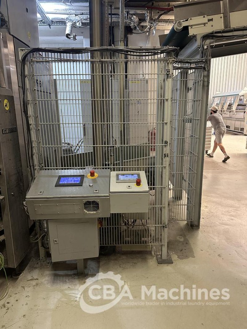 2009 Girbau stationary lift + conveyor to load the 100kg dryer
