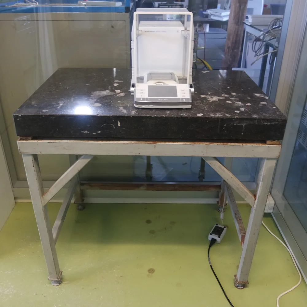 1057-Used laboratory weighing table, granite top