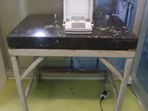 1057-Used laboratory weighing table, granite top